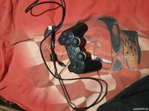 vand o maneta sony de consola 