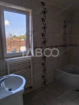 Casa tip insiruita de vanzare 147 mp cu garaj si curte in Sura Mare  - imagine 9