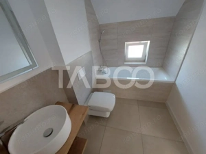 Casa de vanzare 4 camere 3 bai 119 mp cu teren 470 metri in Talmaciu - imagine 14