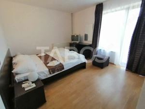 Pensiune 13 camere 16 bai sauna piscina si teren 1565 mp Cisnadioara - imagine 14