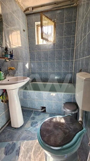 Casă individuală compusă din două apartamente, cu teren liber de 540 mp  - imagine 14