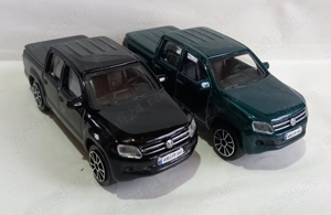 2 machete auto Volkswagen Amarok 2011 scara 1:43 Bburago (55 - 45 lei)