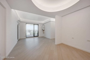 Apusul de la ultimul etaj din Cortina North | 3 camere | 76.7 mp - imagine 2