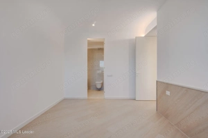 Apusul de la ultimul etaj din Cortina North | 3 camere | 76.7 mp - imagine 7