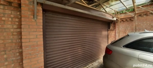 Reparații uși garaj