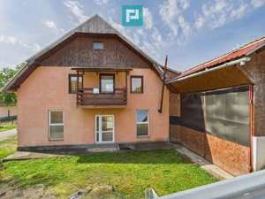 Casă și centru comercial, în localitatea Lazuri