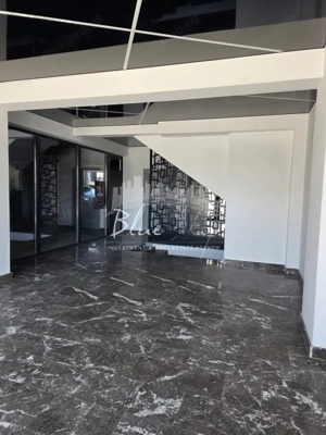 Apartament modern cu balcon generos și acces la piscină - imagine 14