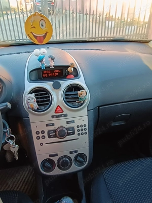 Opel Corsa D 1.3 dti - imagine 9