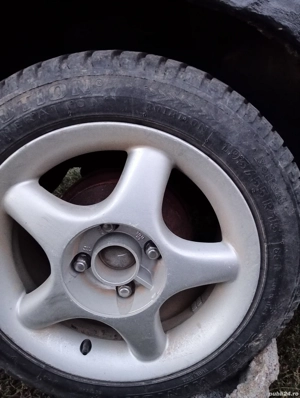vand 4 jante aliaj cu anvelope aproape noi de iarnă în 4 prezoane detalii la telefon   - imagine 2
