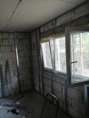 Două case pe același teren,una noua construita și neterminată in interior și o casă batraneasca  - imagine 4