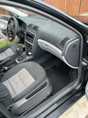 Skoda Octavia 2011 + 4 roti cu anvelope de iarna - imagine 5