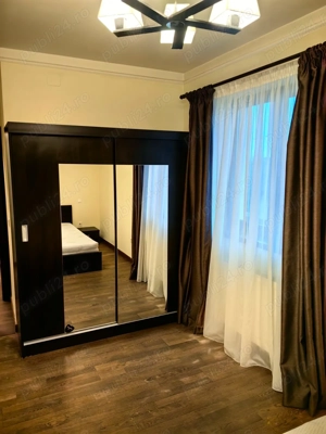 Proprietar, inchiriez apartament cu 3 camere de lux in bloc cu 4 nivele la etajul 1 - imagine 9
