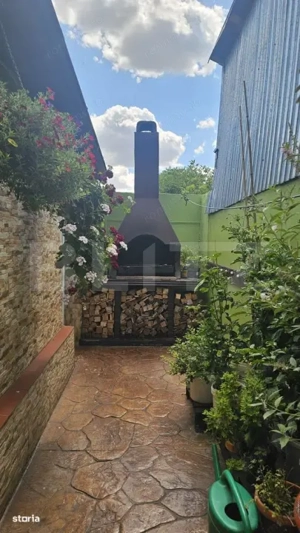 Casă spațioasă cu mansardă, curte amenajată cu grătar și beton, Zona Pucheni