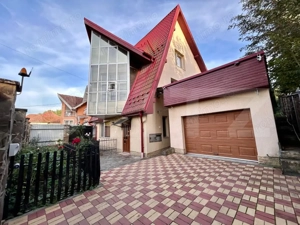 Casa moderna cu design deosebit,situata intr-o zona linistita. - imagine 2