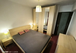 Apartament decomandat, mobilat, utilat, cu doua camera si loc de parcare in Racadau - imagine 3