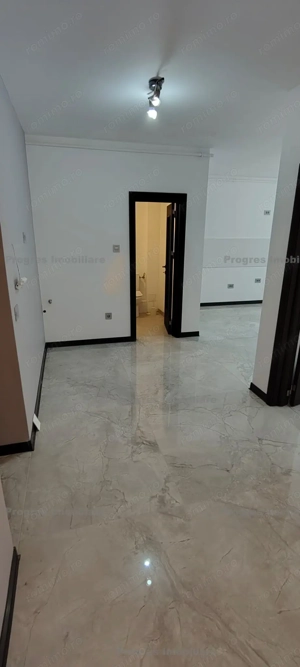  Apartament 2 camere - bloc nou - drum asfaltat - 74.500 euro