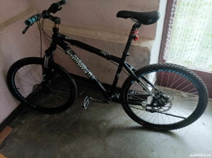 vând mtb cu frîne hidraulice 