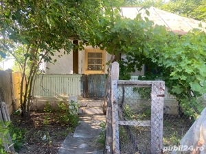 teren(cu casa)in zona Dragasani