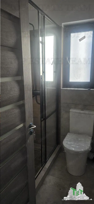 Bragadiru cart. Independentei  Vanzare apartament 2 camere in vila  curte proprie  2 locuri de parca - imagine 18