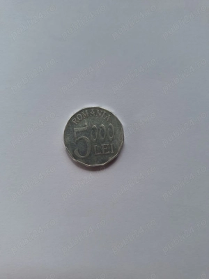 Vând monedă rară, 5000 lei, din 2002, confecționată din aluminiu. Are forma cu 12 laturi.