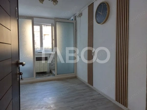 Garsoniera 11 mp renovata total in 2025 etaj 1 baie proprie Cisnadie - imagine 2