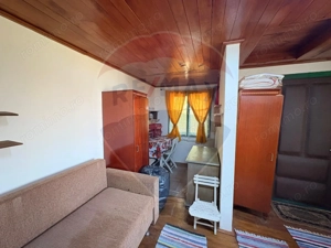 Teren intravilan 589 mp si cabana din caramida in Cuvin