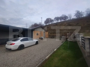 Casa pe 2 nivele cu 5 camere si 140 mp +teren 850 mp oras Beclean,zona Romfulda - imagine 3