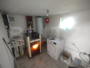 Casa pe 2 nivele cu 5 camere si 140 mp +teren 850 mp oras Beclean,zona Romfulda - imagine 12