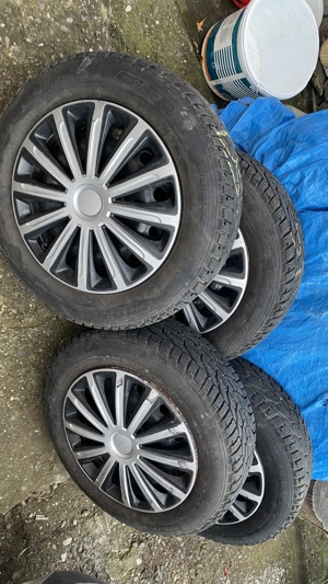 Vând 4 jante de tablă cu cauciucuri de iarnă și capace, pt Logan - imagine 4