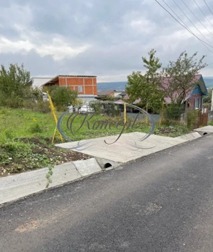 Teren intravilan generos cu utilitati si front larg in Jucu de Sus