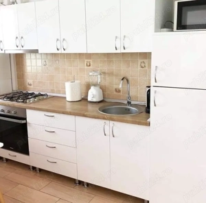 In Centru pe vulevardul Uniirii dau in chirie apartament cu 2 camere - imagine 6