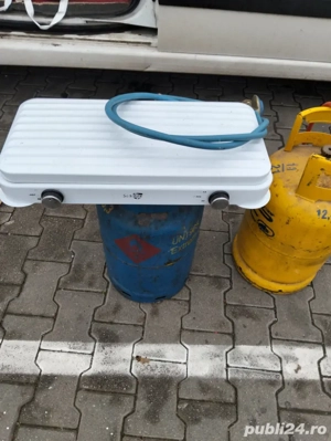 vind butelie aragaz cu aragaz doua ochiuri se vinde complet.