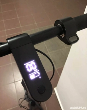 trotineta electrica și un redmi 13 note 