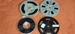  Pt. aparat proiectie  4 role pelicula 8 mm  ( NU CUNOSC CONTINUTUL )  diametrul la rola 13 c