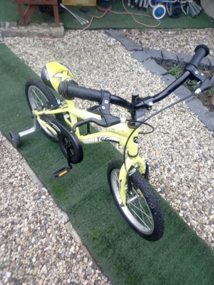 Vând bicicleta copii,germana,cu roti ajutătoare detașabile 