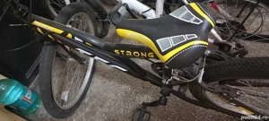 vând bicicleta aproape nouă .