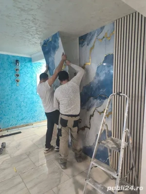 echipa de constructi executam interioare cat si exterioare 