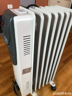Vând calorifer electric pe ulei VORTEX, cu 7 elemenți.
