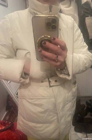 Geaca de damă cu puf de gâscă.