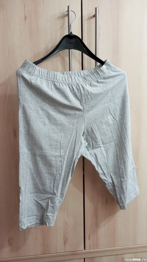 Pantaloni trei sferturi.