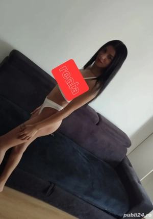 Buna bruneta cu forme te astept la un apel 