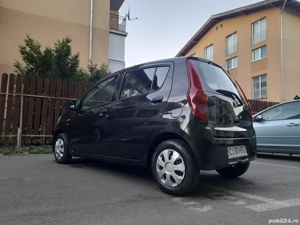 Daihatsu Cuore 2009 - imagine 4