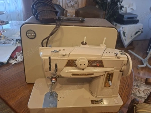 vand mașină  de cusut singer