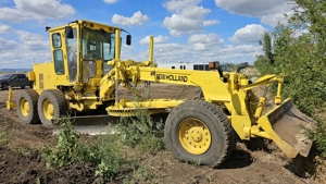 Greder New Holland F106.6 6x4 cu scarificator