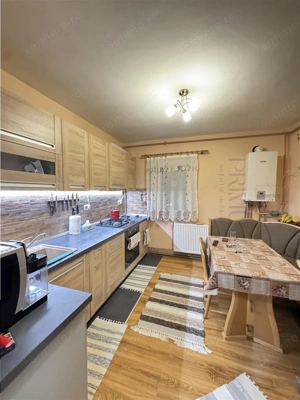 BUZIASULUI - 3 CAMERE - 2 BAI - ETAJUL 1 - 2 BALCOANE - BLOC IZOLAT - CENTRALA PROPRIE