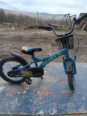 bicicleta 16 inch cu frane , cos fata si sonerie si aparatori