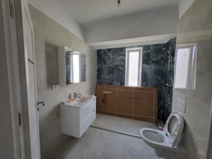 Bloc Nou. Decomandat. Etaj 1.Calea Timisorii . Asfalt. Transport in comun. - imagine 4