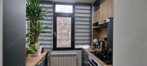 Apartament 2 camere, decomandat, parter, regim hotelier - imagine 2