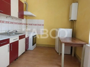 Apartament la casa 52 mp 2 camere terasa pivnita central Cisnadie