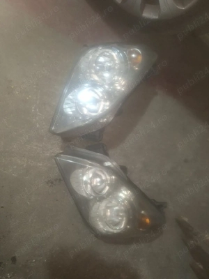 vând far Opel Astra H  - imagine 2